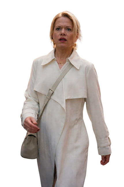 Woman wearing a light-colored trench coat with a white background