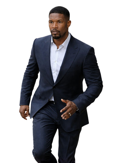 Man wearing a navy suit and white shirt on a white background
