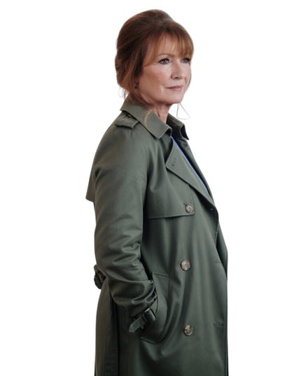Woman wearing a green trench coat on a white background