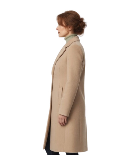 Woman wearing a beige coat on a white background