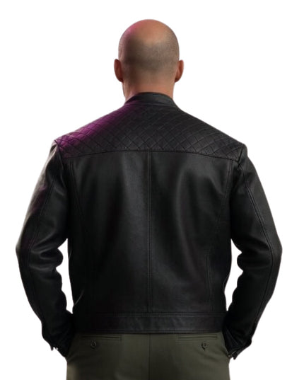 Man wearing a black leather jacket with purple quilted patch on a white background