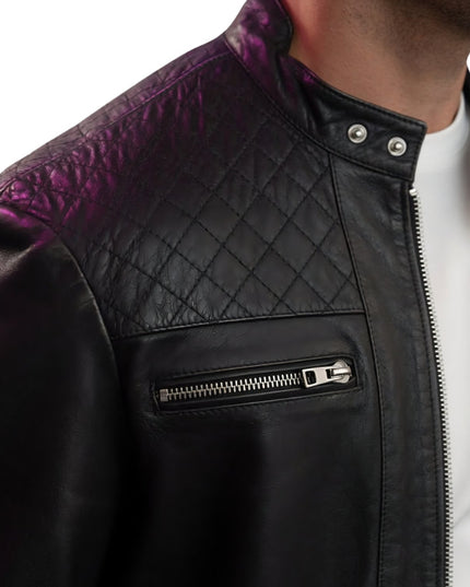 Black leather jacket with purple quilted panel on a white background