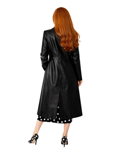 Person wearing a black leather coat with white polka dot trim on a white background