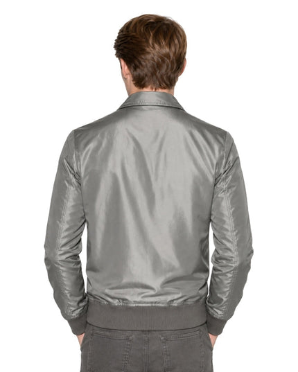 Person wearing a grey bomber jacket 