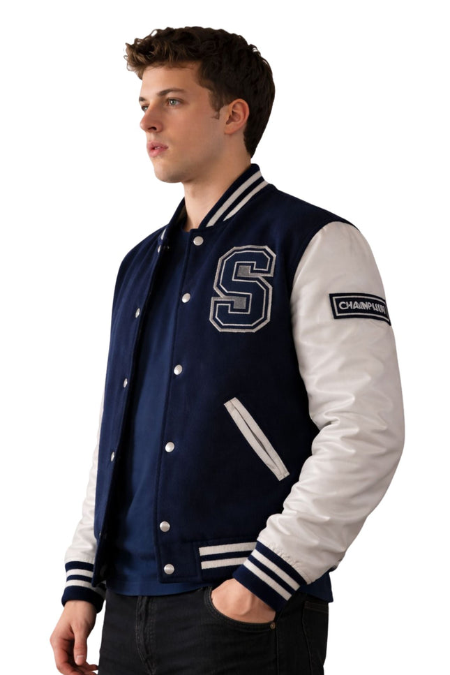 Man wearing a navy and white varsity jacket with a letter 'S' on a white background