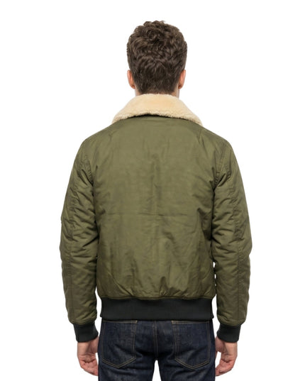 person wearing green jacket on a white background 