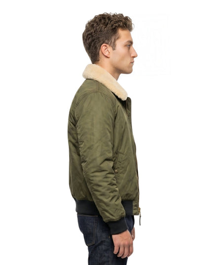 Man wearing a green bomber jacket with white fur lining on a white background