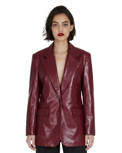 Woman wearing a burgundy leather jacket on a white background