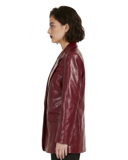 Woman wearing a burgundy leather coat on a white background