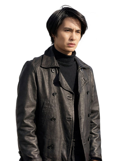 Man wearing a dark leather coat over a black turtleneck on a white background