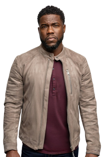 Man wearing a beige leather jacket over a maroon shirt on a white background