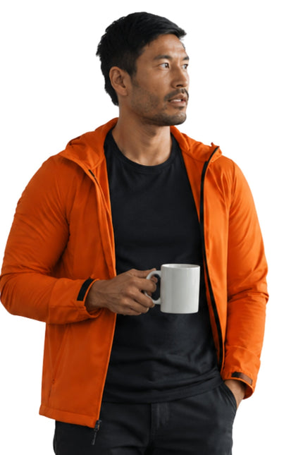 Man wearing an orange jacket holding a white mug on a white background