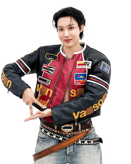 Person wearing a colorful varsity jacket with various brand logos on a white background