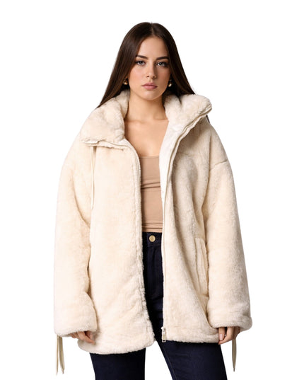 Woman wearing a cream-colored coat on a white background