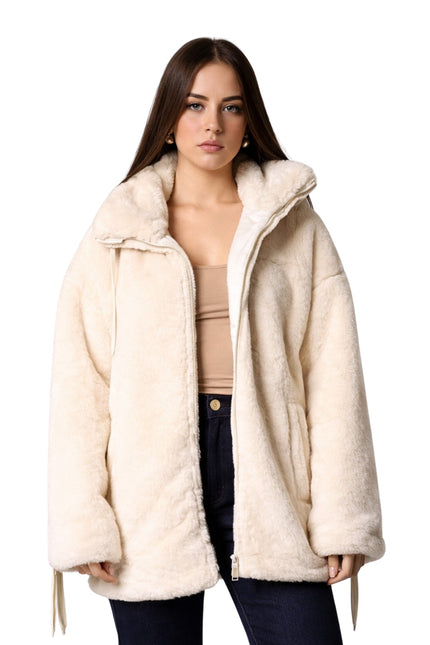 Woman wearing a cream-colored coat on a white background