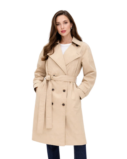 Woman wearing a beige trench coat on a white background