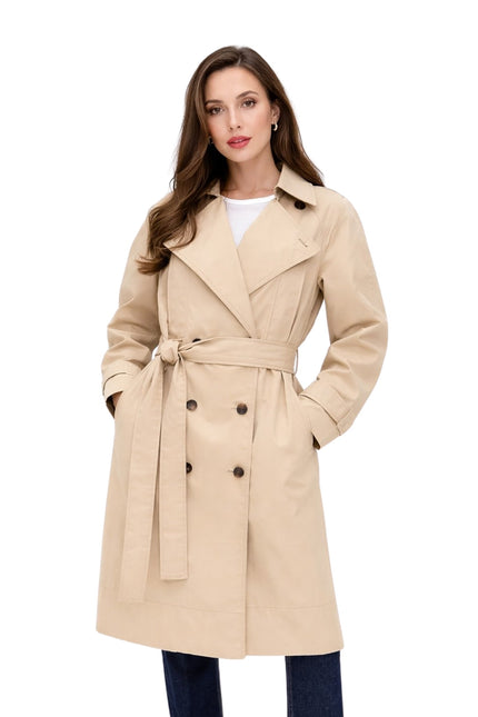 Woman wearing a beige trench coat on a white background