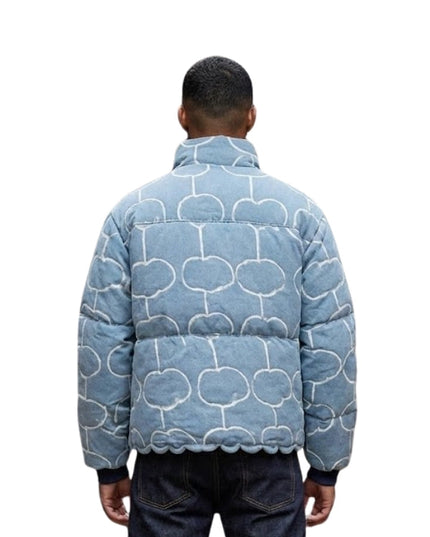 Person wearing a blue patterned jacket on a white background