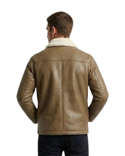 Man wearing a brown leather jacket with white fur lining on a white background