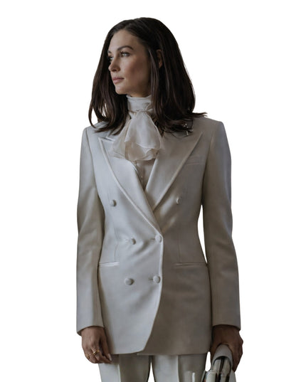 Woman wearing a two-tone blazer with a white background