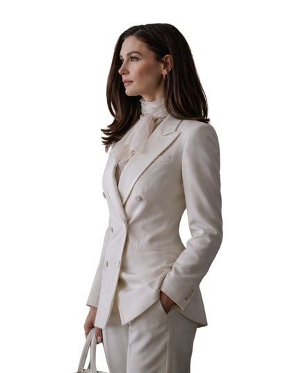 Woman wearing a white suit on a white background