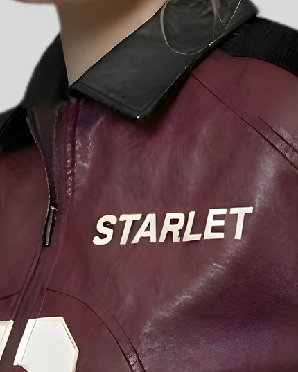 Close-up of a maroon jacket with 'STARLET' branding on a neutral background