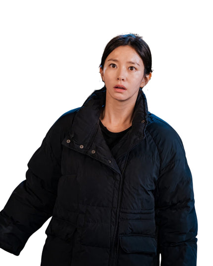 Person wearing a black puffer jacket on a white background