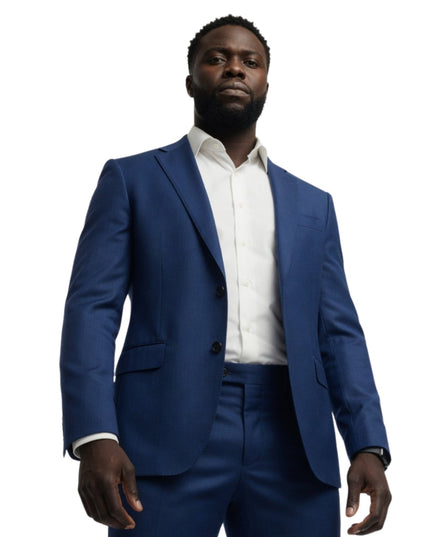 Man wearing a blue suit and white shirt on a white background