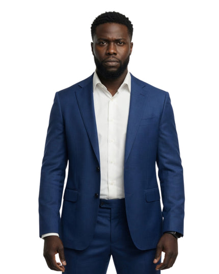 Man wearing a blue suit and white shirt on a white background
