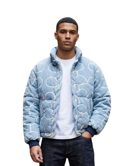 Person wearing a blue patterned jacket on a white background