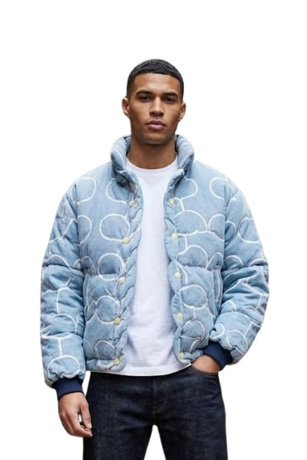 Person wearing a blue patterned jacket on a white background