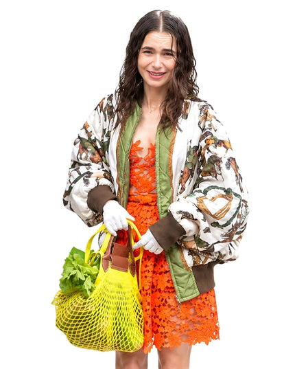 Person wearing a printed bomber jacket 