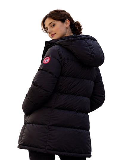 Person wearing a black puffer jacket with a visible brand logo on a white background