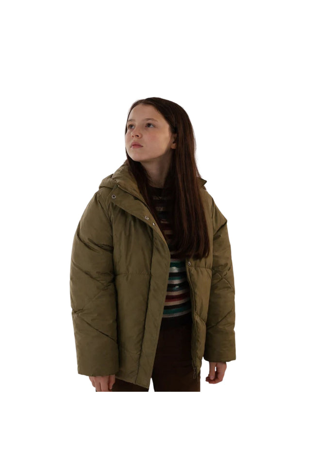 Person wearing a brown puffer jacket on a white background