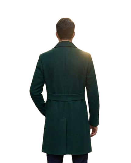 Man wearing a green overcoat from behind on a white background
