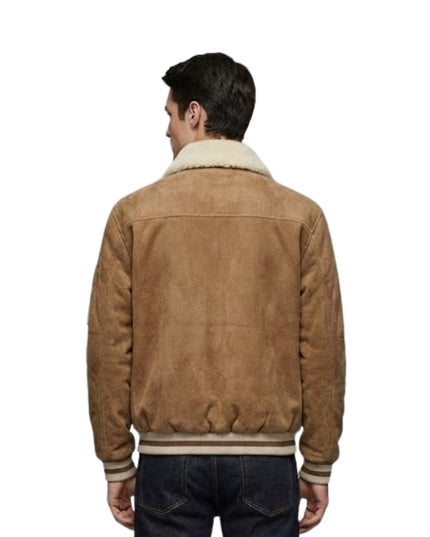 Man wearing a brown suede jacket with a white collar on a white background