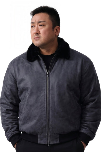 Man wearing a dark gray jacket with a black collar on a white background
