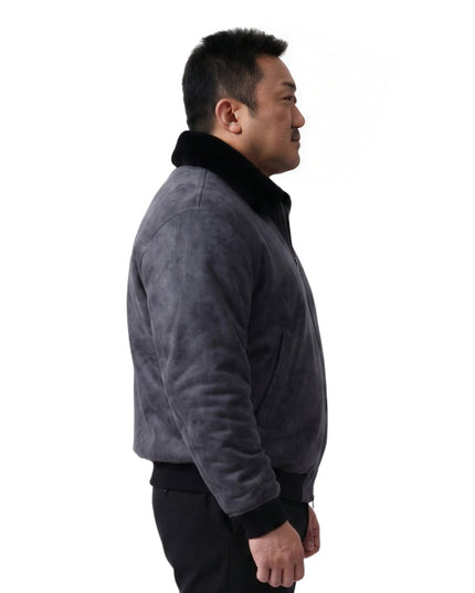 person wearing black jacket standing in sided pose 