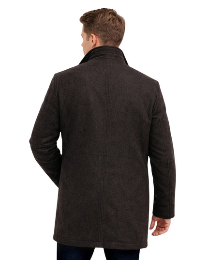 Man wearing a brown coat on a white background