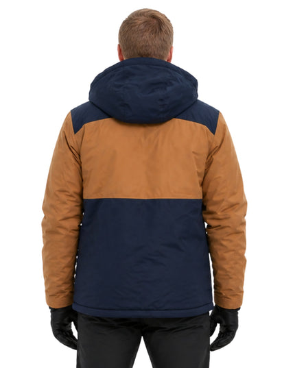 Person wearing a two-tone brown and navy jacket on a white background