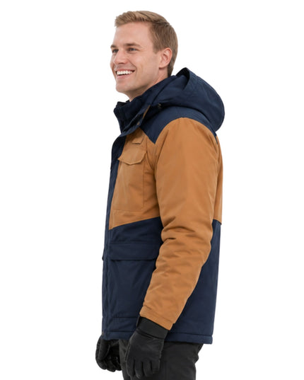 Man wearing a two-tone jacket with navy and brown colors on a white background
