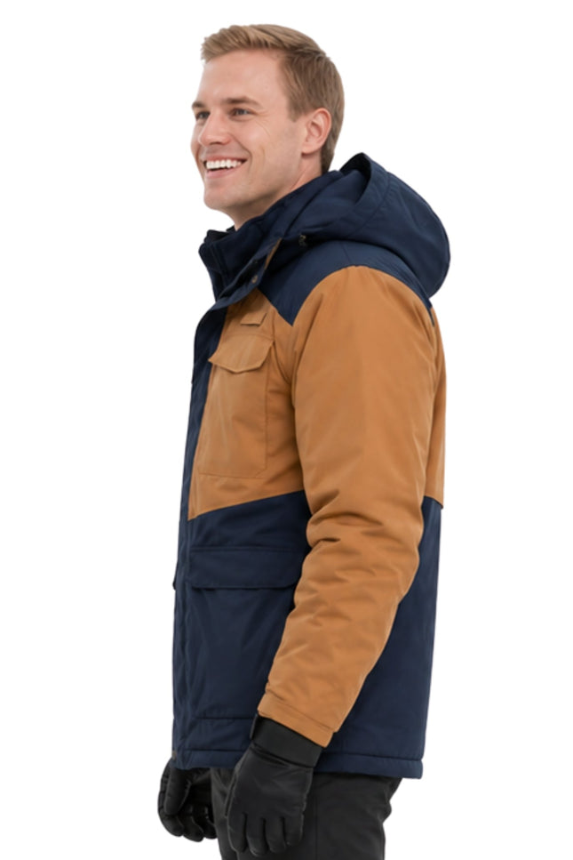 Man wearing a two-tone jacket with navy and brown colors on a white background