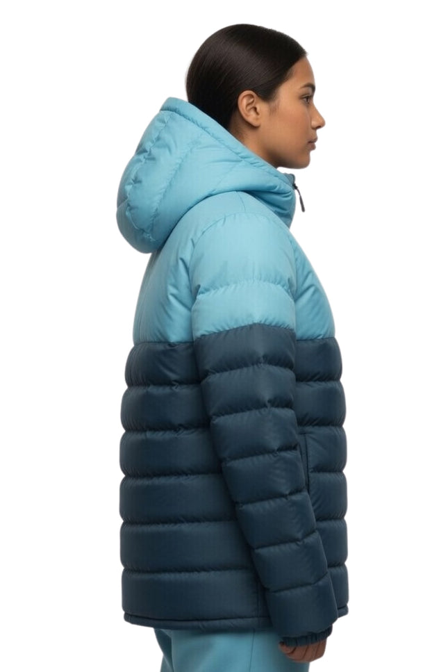 Person wearing a two-tone blue puffer jacket on a white background
