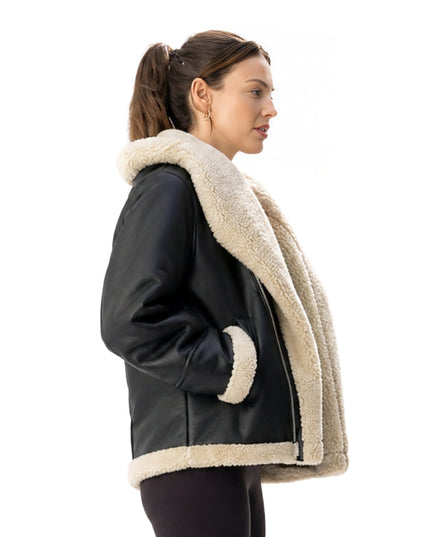 Person wearing a black leather jacket 
