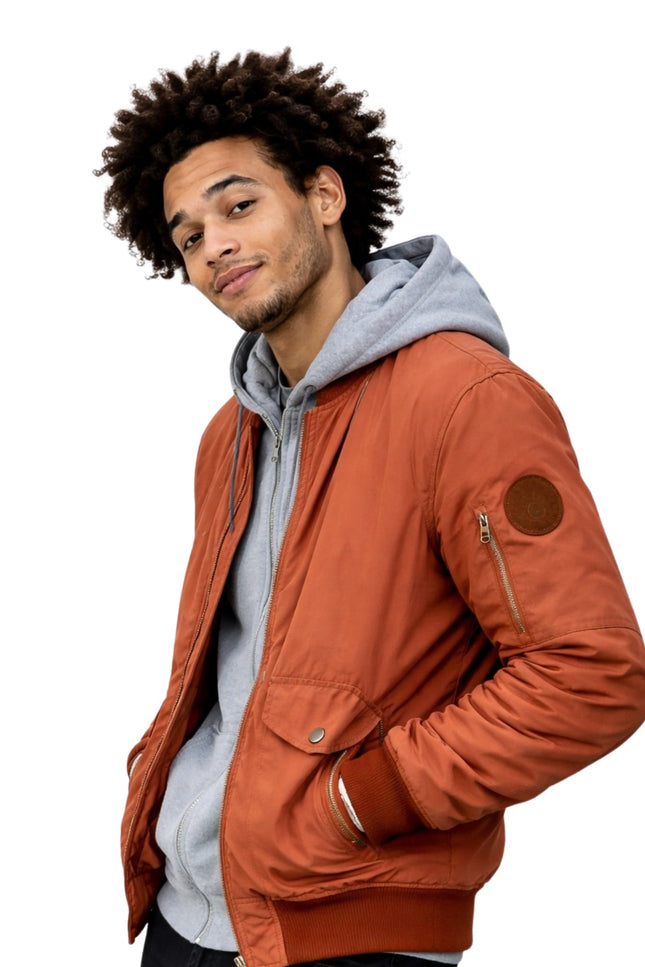 Man wearing a brown jacket with a white background