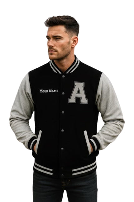 Man wearing a black and gray varsity jacket with a letter 'A' on a white background