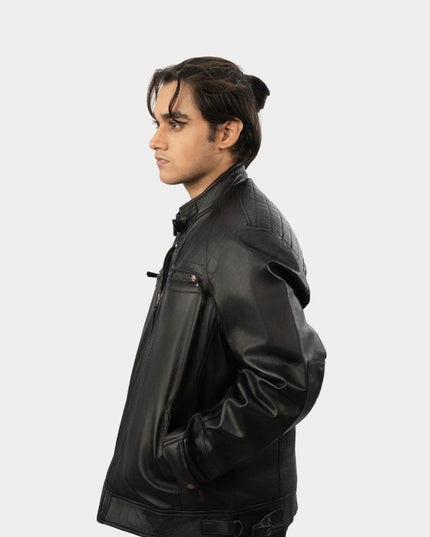 Person wearing a black leather jacket on a white background