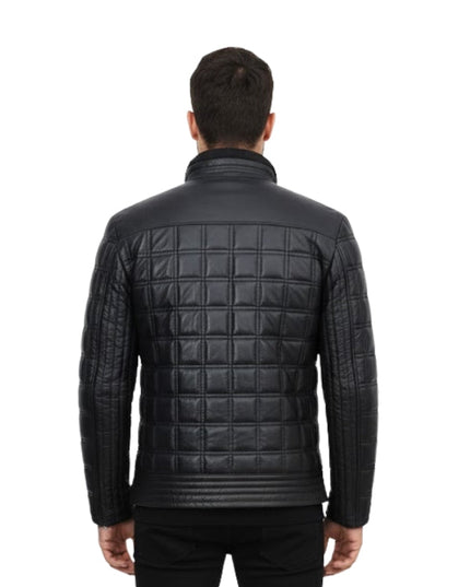 Man wearing a black quilted jacket on a white background