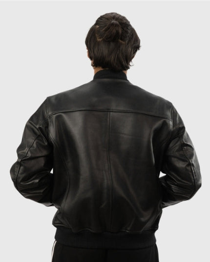 Person wearing a black leather jacket on a white background