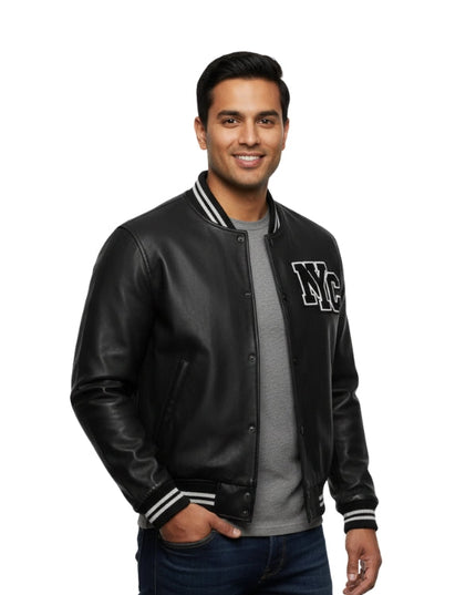 Man wearing a black varsity jacket with 'NYC' on a white background